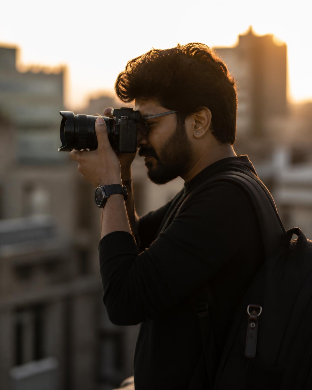 Srinivas of SS Photography shooting on location at dusk with a mirrorless camera